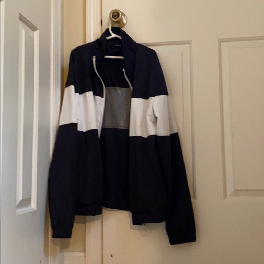 A black and white wind breaker